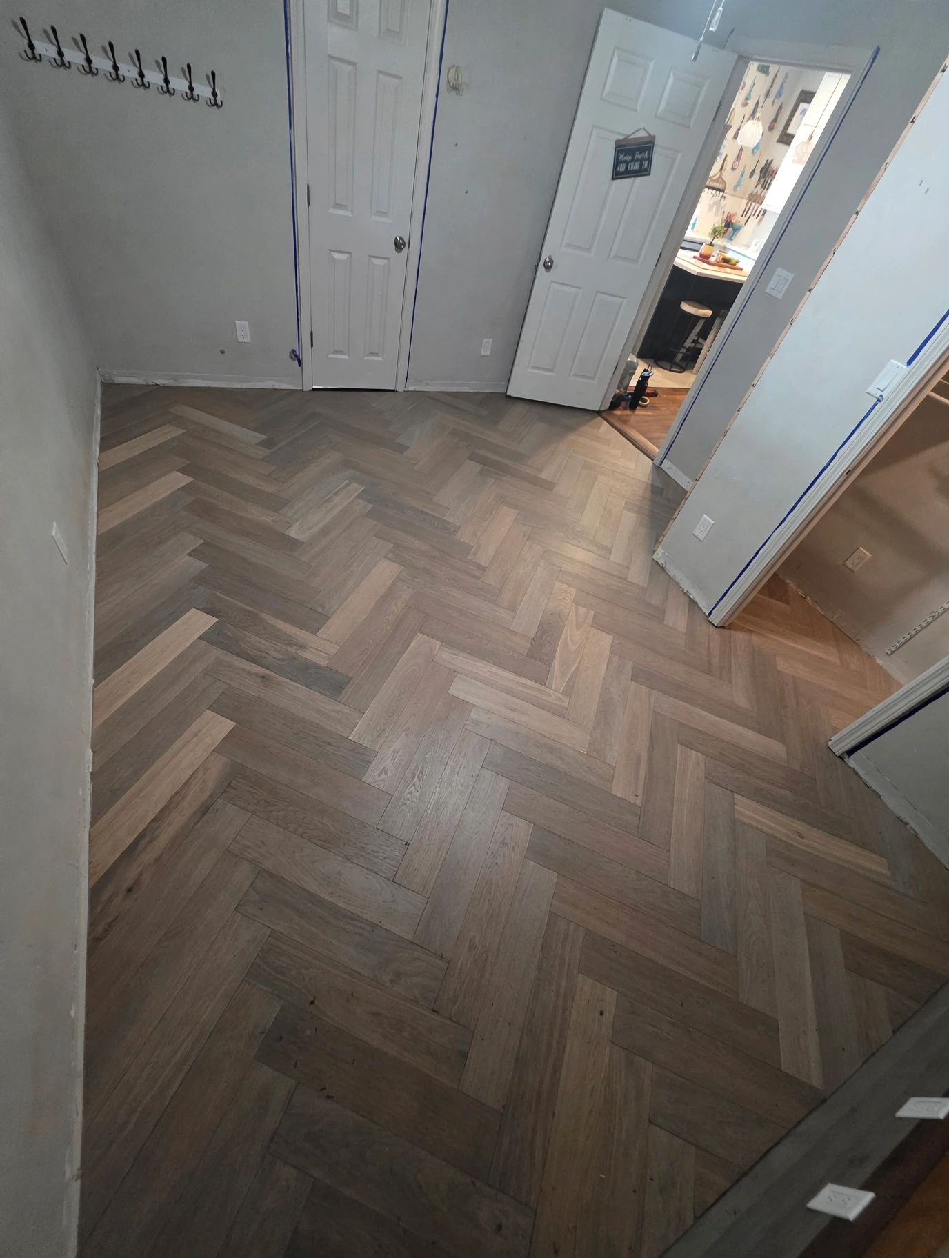 Completed herringbone wood-look floor installation